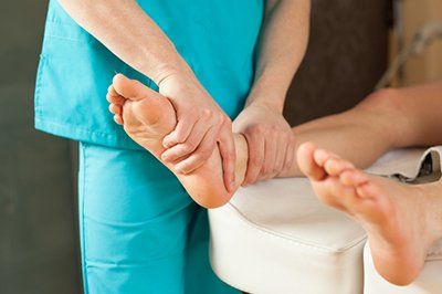 Podiatric Doctor — Massaging Foot in Pompano Beach, FL