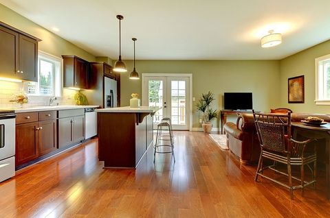 Modern new brown kitchen with cherry floor