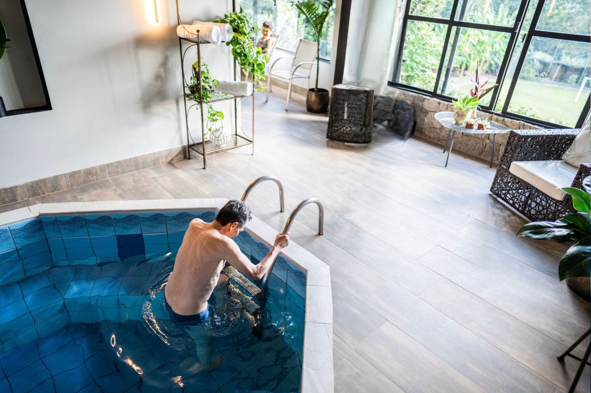 Man emerging from a cold plunge pool