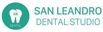 The logo for san leandro dental studio shows a tooth in a circle.