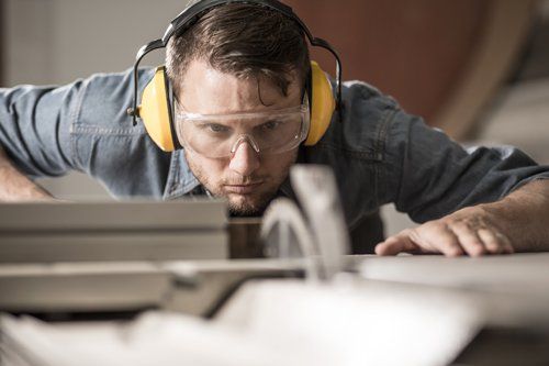 Man with Clear Glass and Yellow Headset — Travelers Rest, SC — Guy M Beaty Co