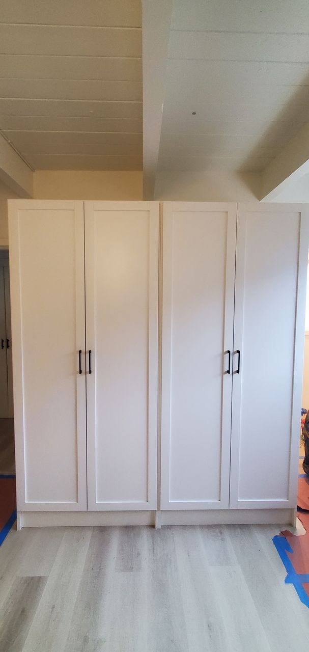 a custom white closet cabinets