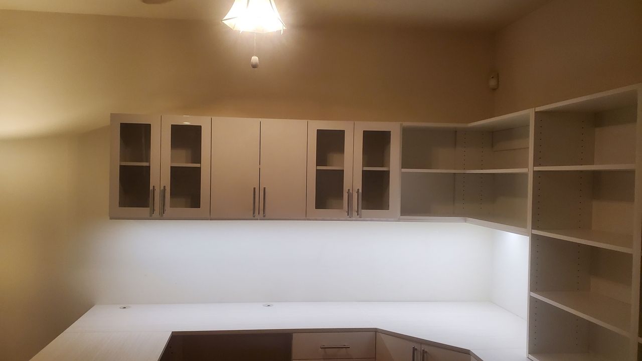 a custom kitchen pantry room with cabinets, drawers and kitchen counter