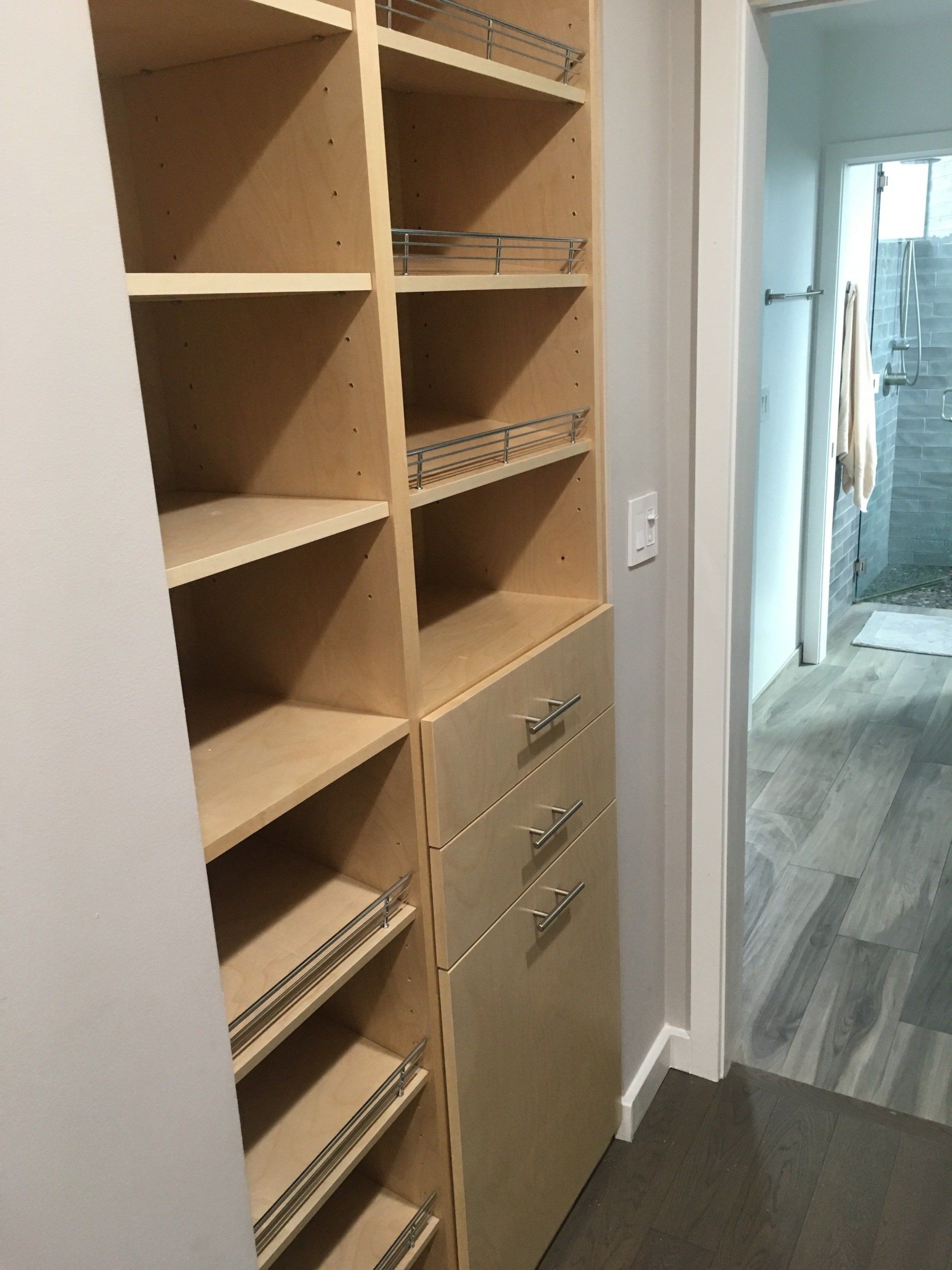 a custom walk-in closet with lots of shoe fences and drawers