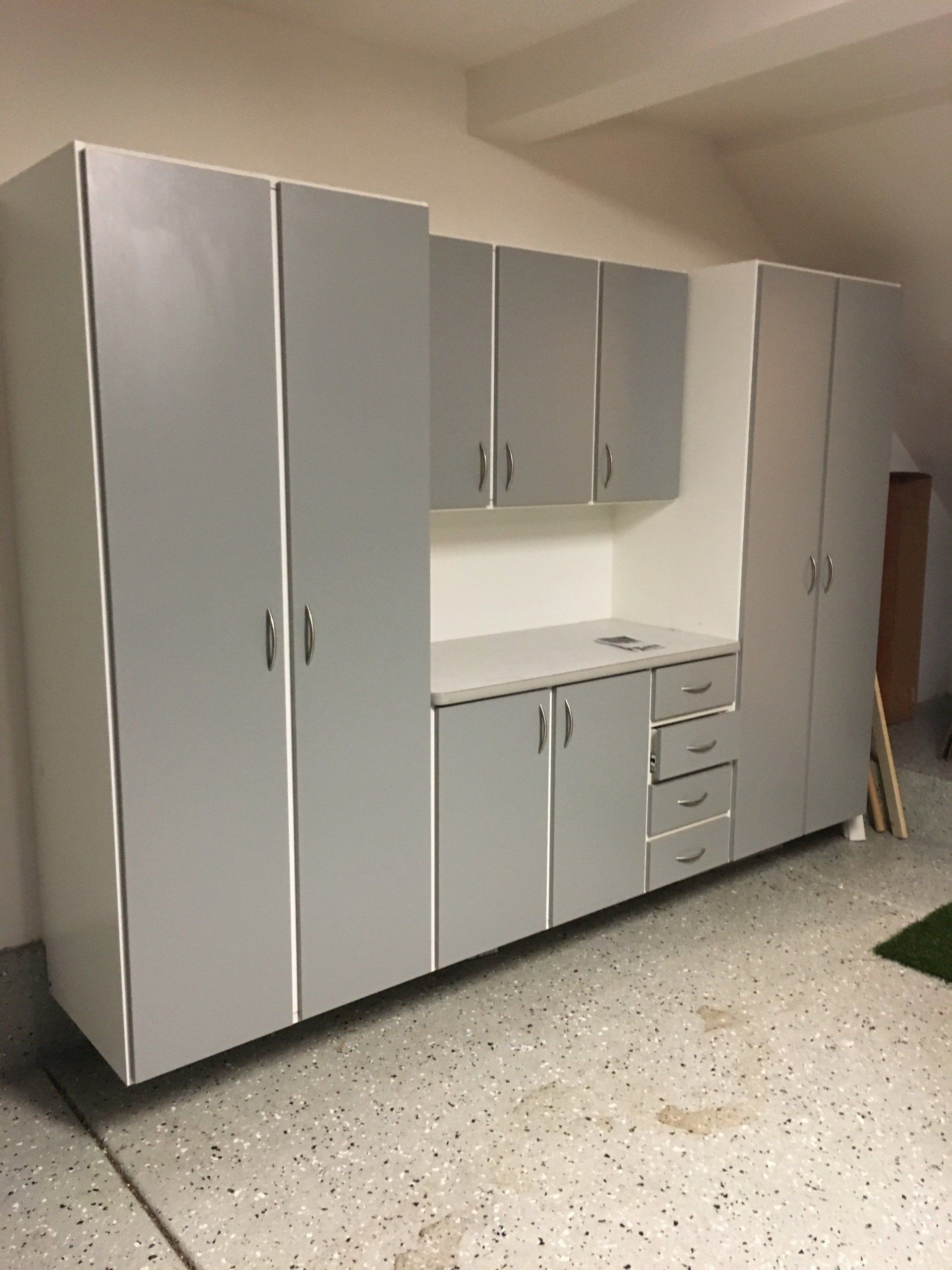 a grey garage cabinet system