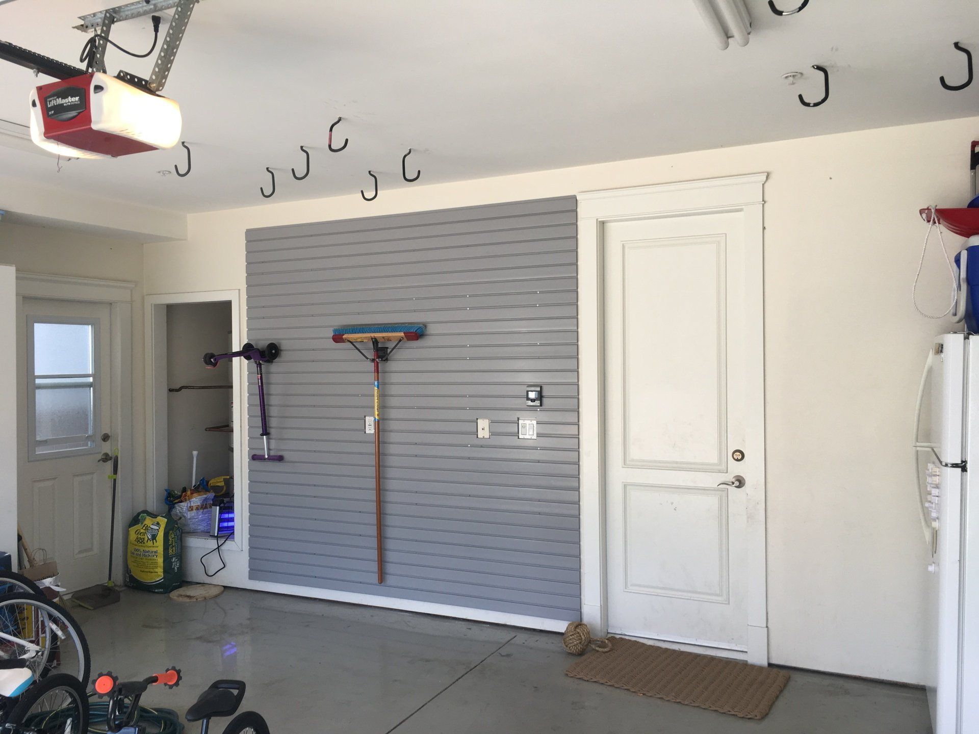 a grey slatwall storage systems