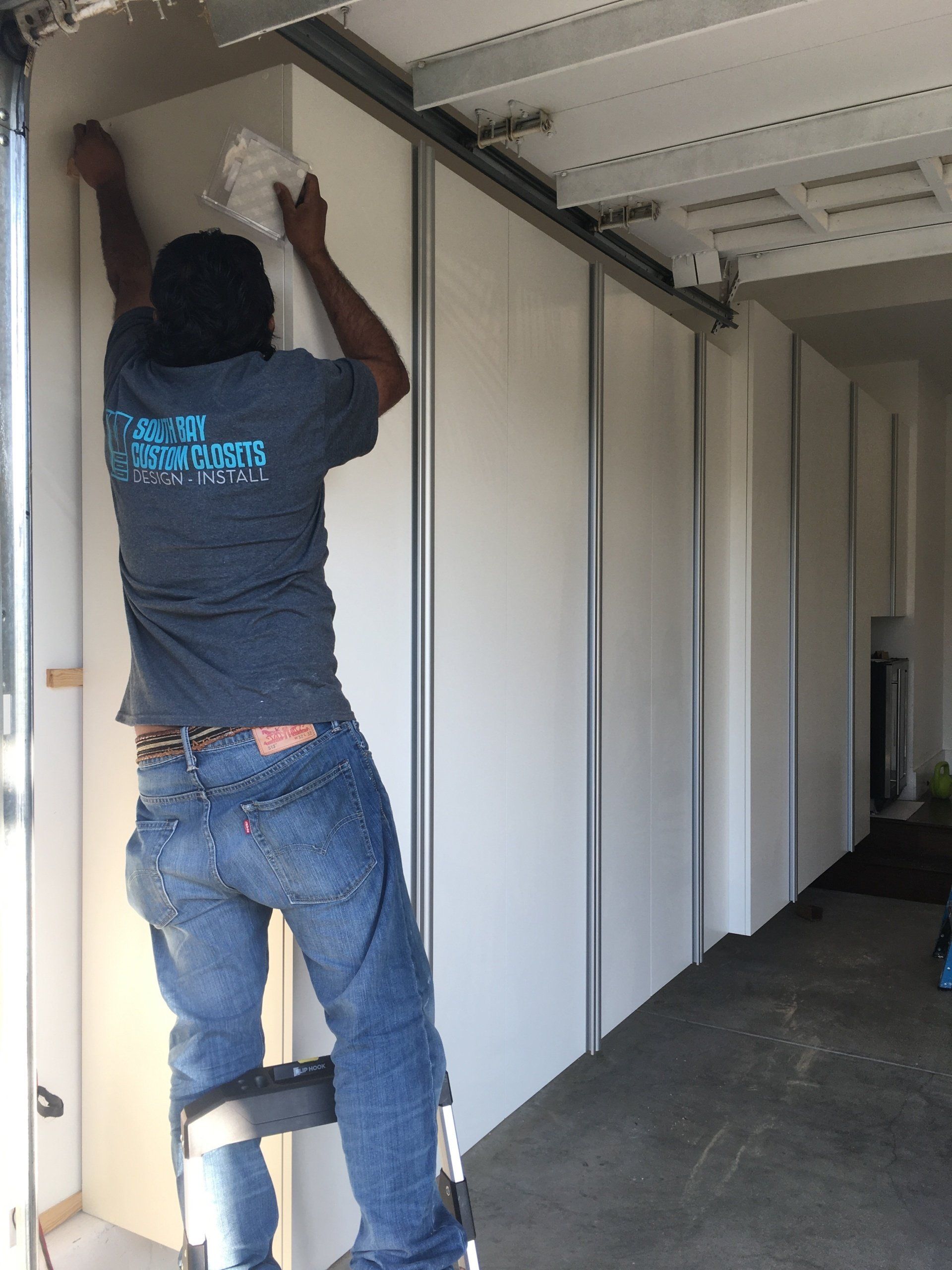 a south bay installer working on the cabinet system
