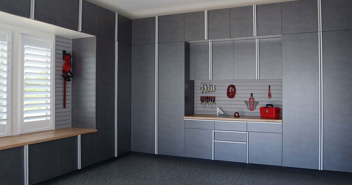 a well-organized garage with a countertop and cabinets for efficient storage and workspace.