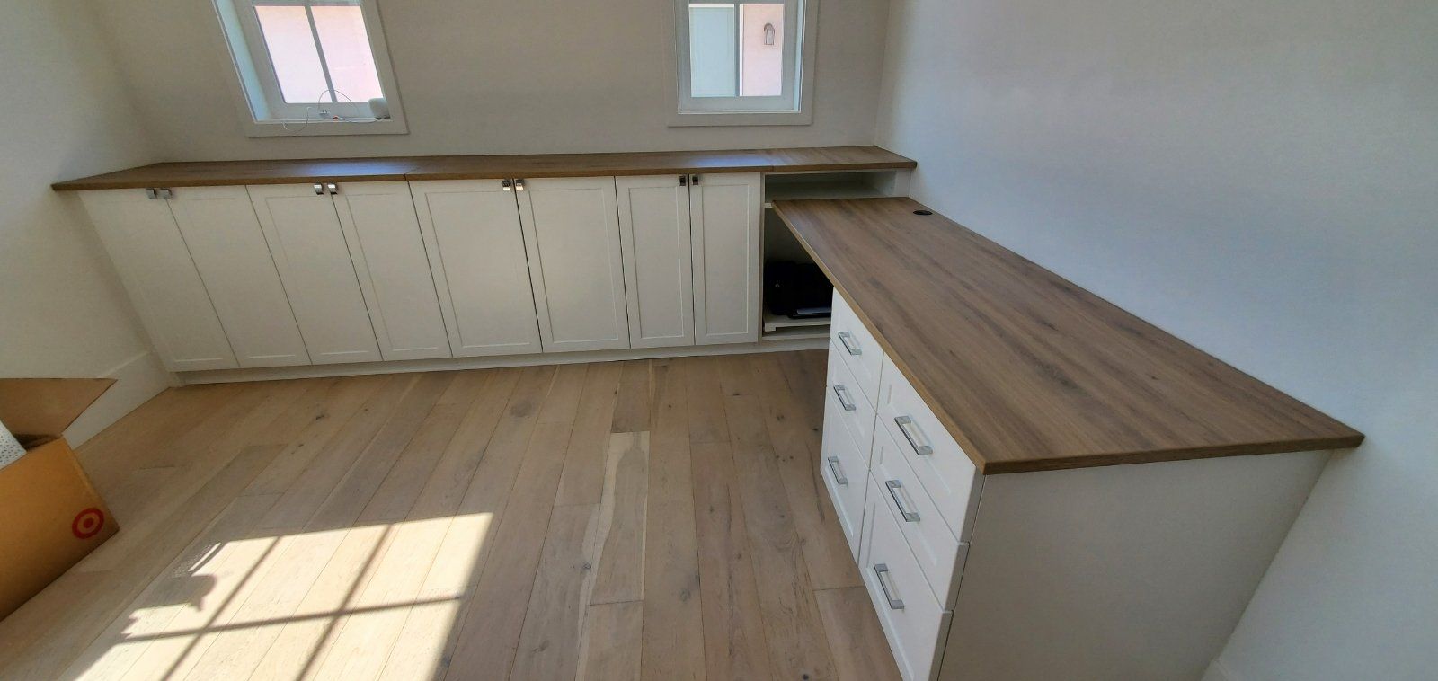 custom home work office with drawers and cabinet