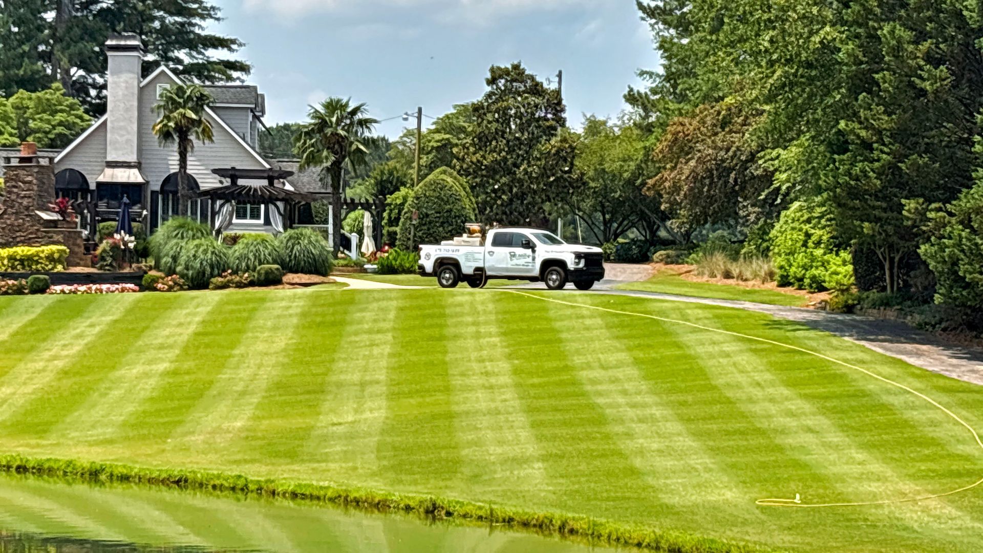 a home in Stockbridge whose lawn has been treated, resulting in thicker, healthier grass
