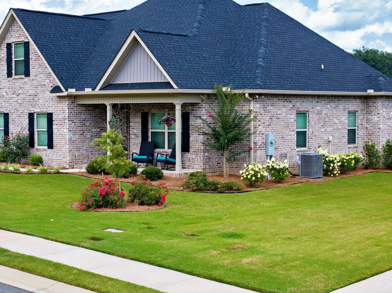 a home in Forsyth whose lawn has been treated, resulting in thicker, healthier grass
