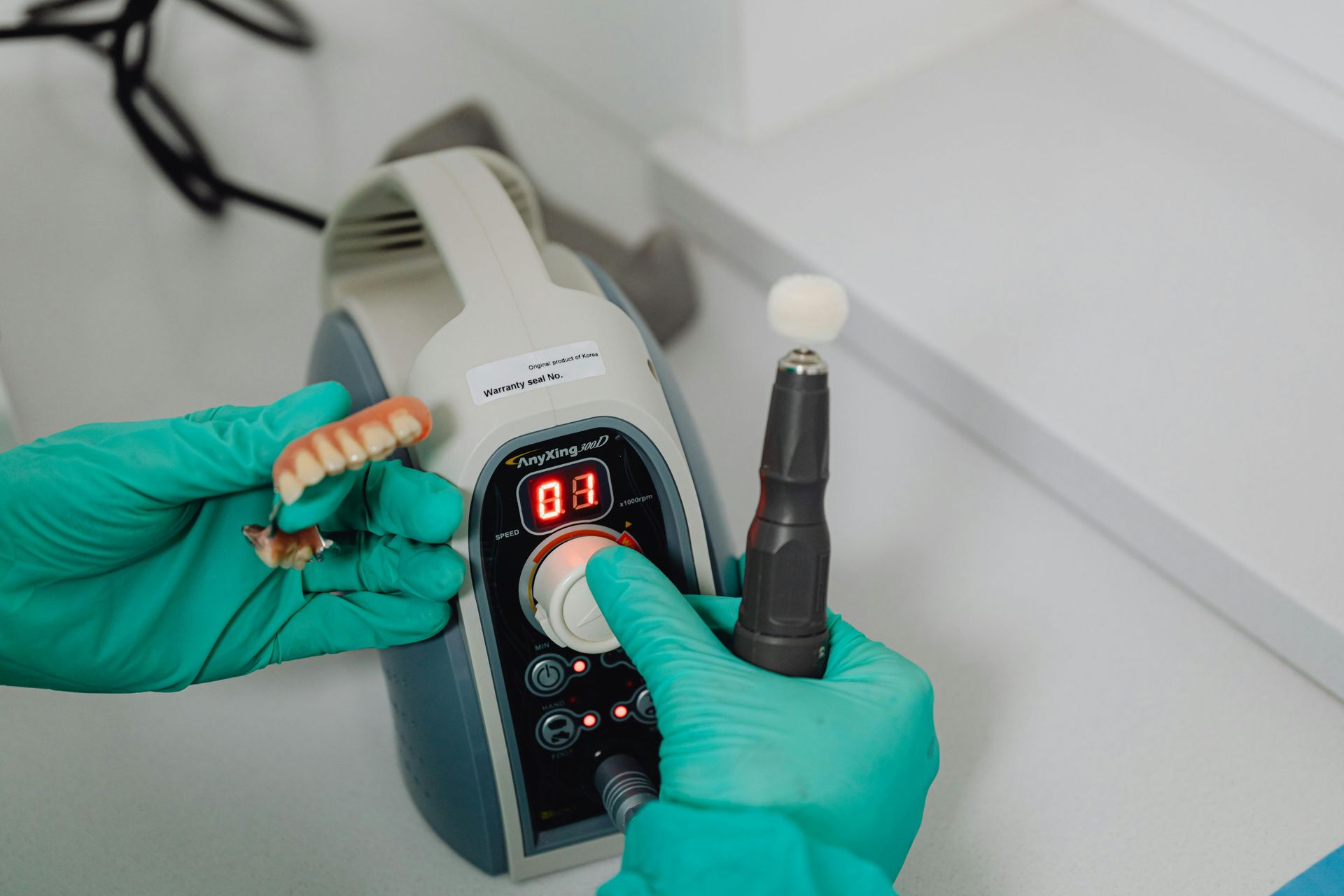 Four Dental Dentures on White Molds — My Denture Clinic in Benowa, QLD