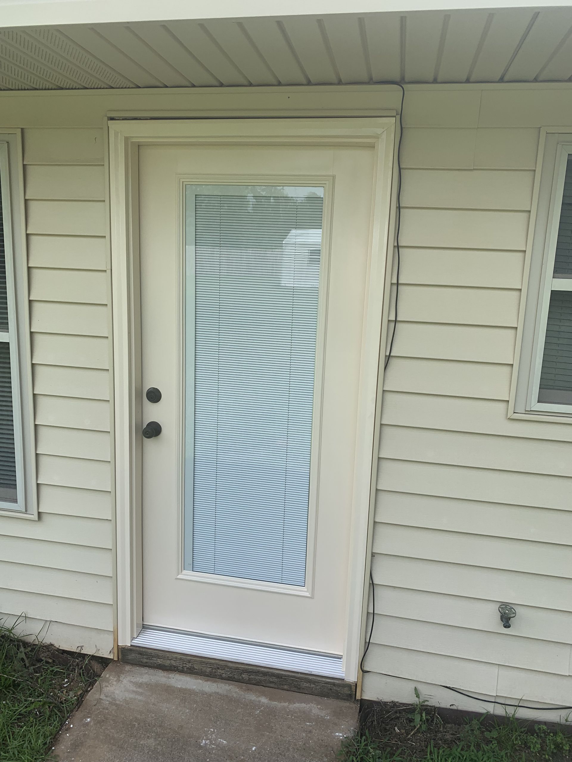 A white door with a swirl design on it