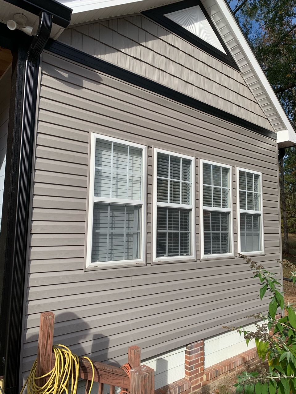 A house with a lot of windows on the side of it.