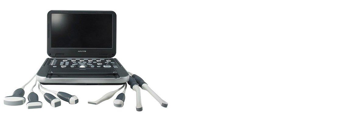 A portable ultrasound machine with multiple probes. It has a screen and control panel.