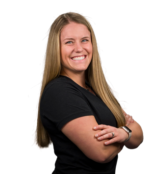 A woman in a black shirt is smiling with her arms crossed.