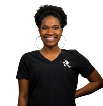 A woman wearing a black shirt with the letter r on it