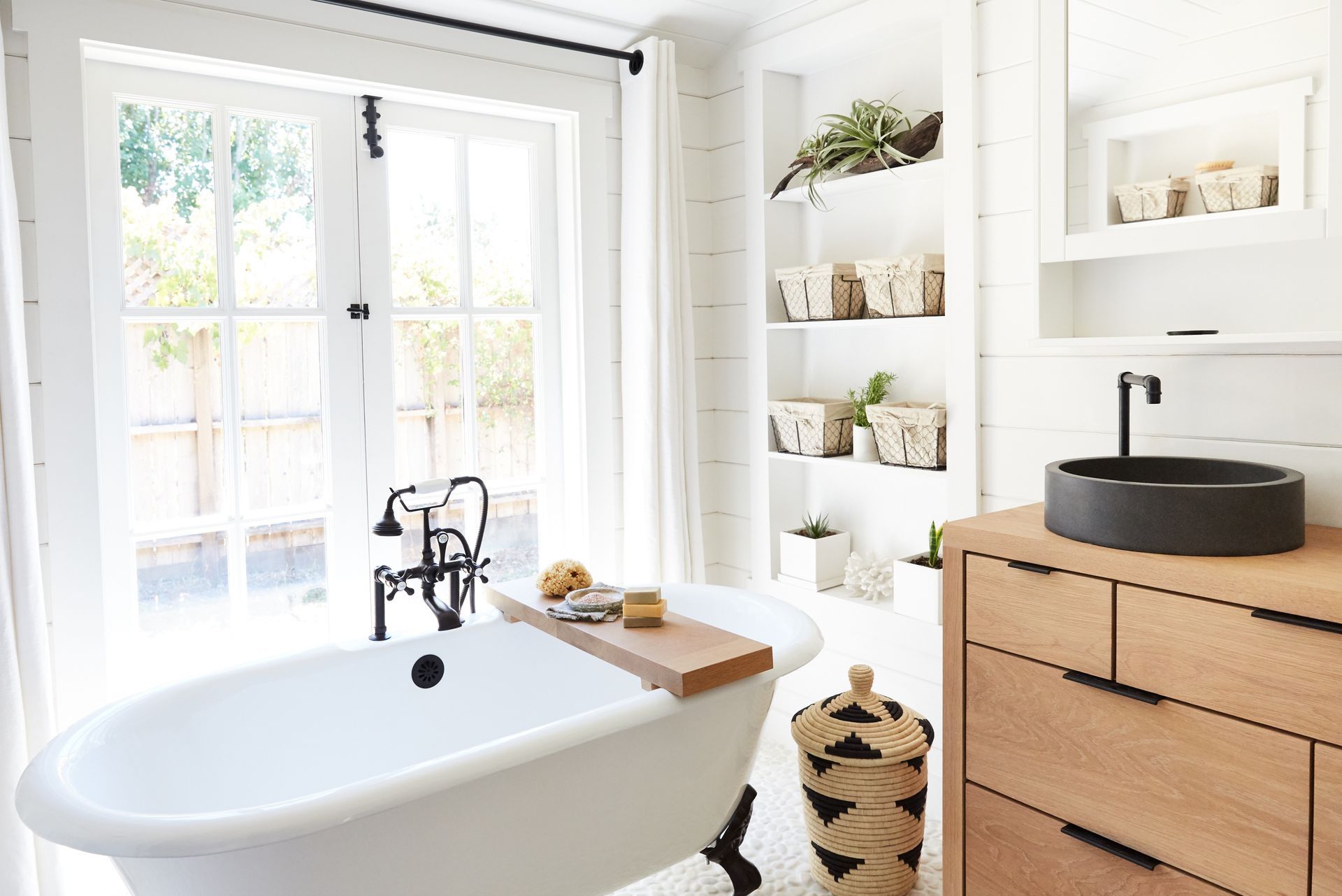 A rustic modern farmhouse bathroom in a small cottage, showcasing home interior remodeling.