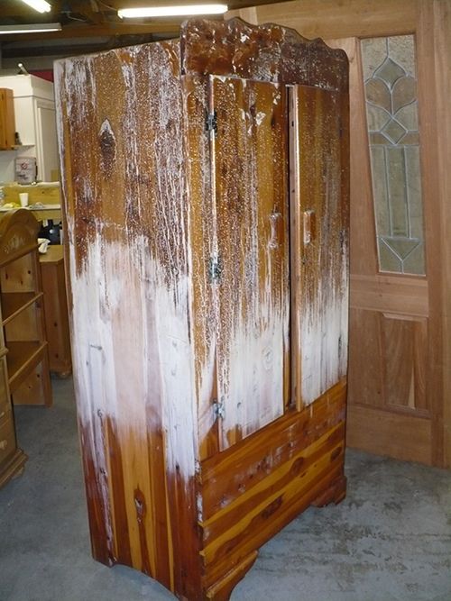 A piece of wood that has been painted brown and white