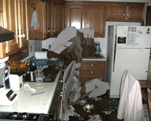 A kitchen with a refrigerator