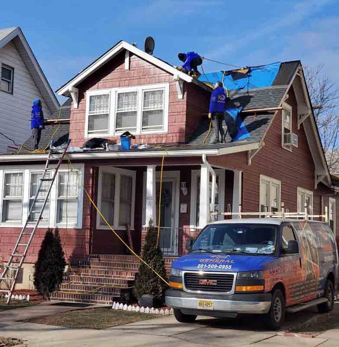 Professional Workers Installing New Residential Roof