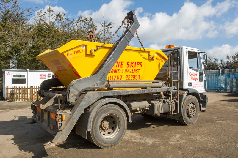 a huge vehicle carrying the skips