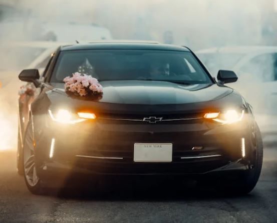 Vehicle with bouquet on hood for transport and ship-out care, funeral homes Phoenix, AZ
