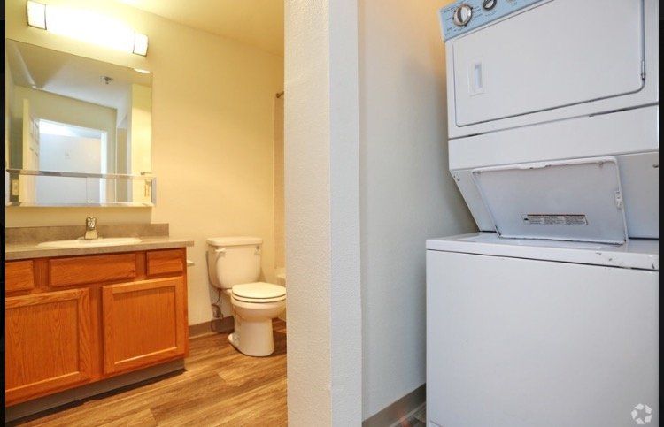 A view of the washer and dryer available in Ever Green Apartments