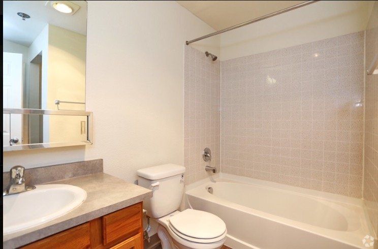 Bathroom with full tub and shower available in Ever Green apartments