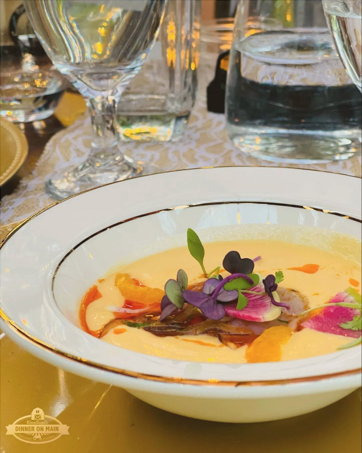 a close up of a bowl of soup on a table