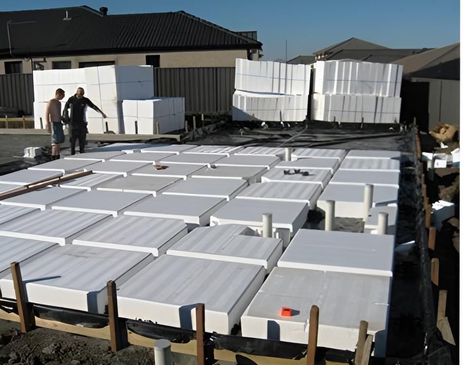 A Stack Of Styrofoam Blocks On A Construction Site — Concept Concreting NSW In Figtree, NSW