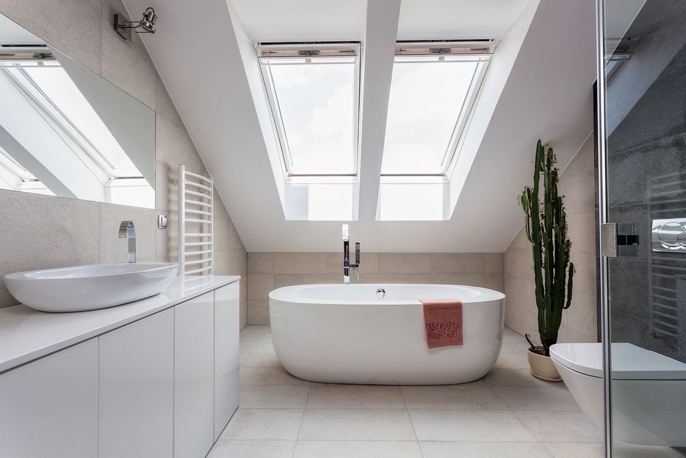 A Bathroom With a Bathtub and Skylights — Hunter Kitchen King In Singleton, NSW