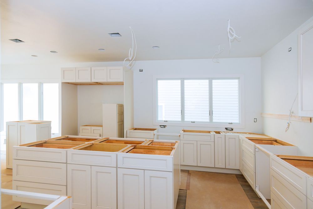 A Kitchen Under Construction With White Cabinets and Wooden Counter Tops — Hunter Kitchen King In Port Stephens, NSW