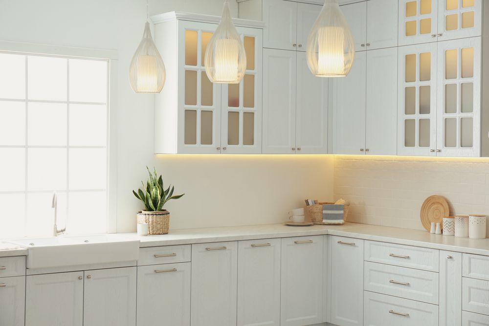 A Kitchen With White Cabinets and a Window — Hunter Kitchen King In Lake Macquarie, NSW