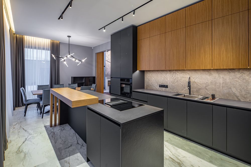 A Modern Kitchen With a Large Island in the Middle of the Room — Hunter Kitchen King In Toronto, NSW