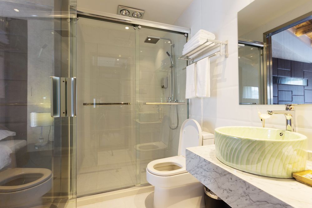 A Bathroom With a Toilet and Mirror — Hunter Kitchen King In Cessnock, NSW