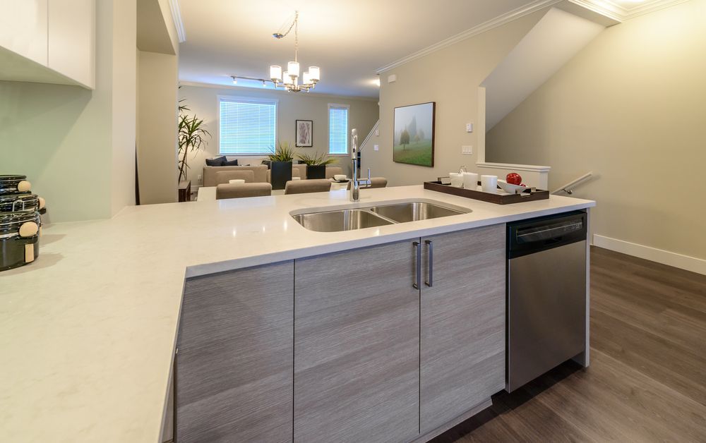 A Kitchen With a Sink and a Dishwasher in a House — Hunter Kitchen King in Hamilton, NSW