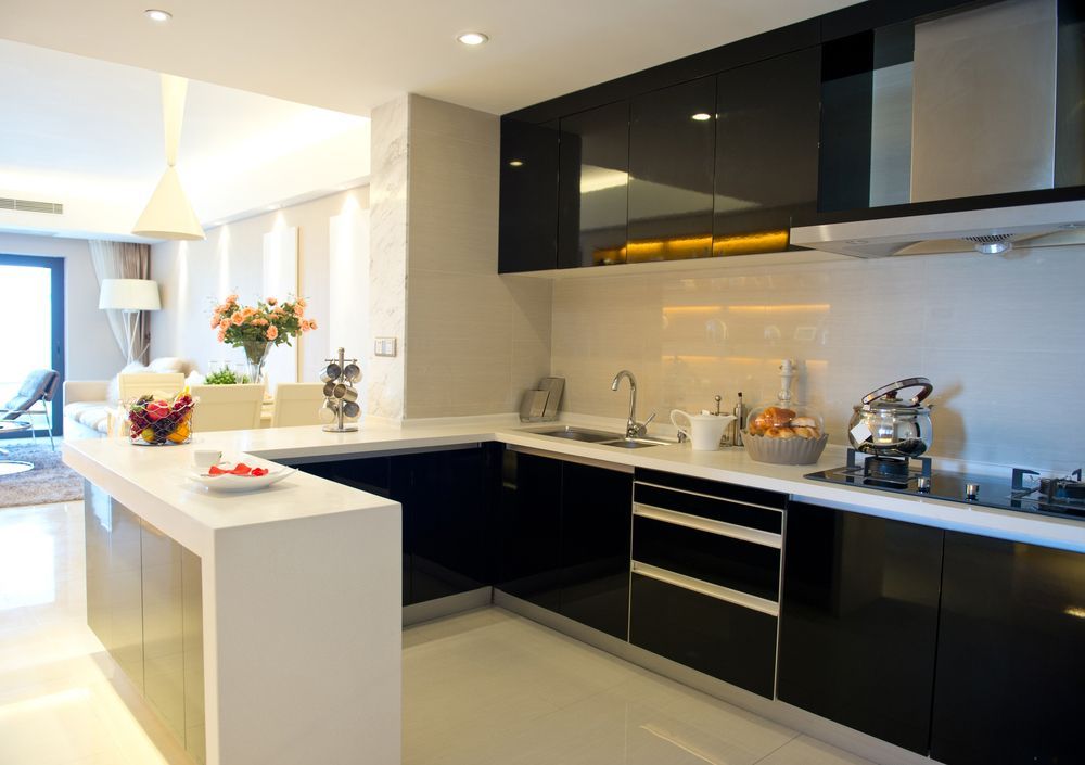 A Kitchen With Black Cabinets and White Counter Tops — Hunter Kitchen King In Kotara, NSW