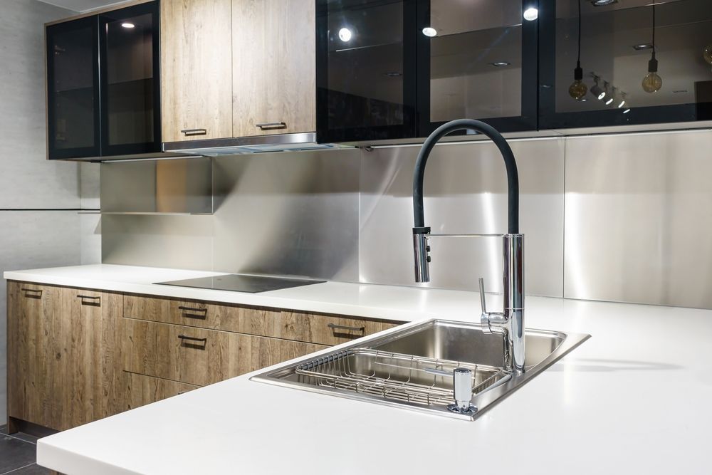 A Kitchen With a Stainless Steel Sink and a Black Faucet — Hunter Kitchen King In Belmont, NSW