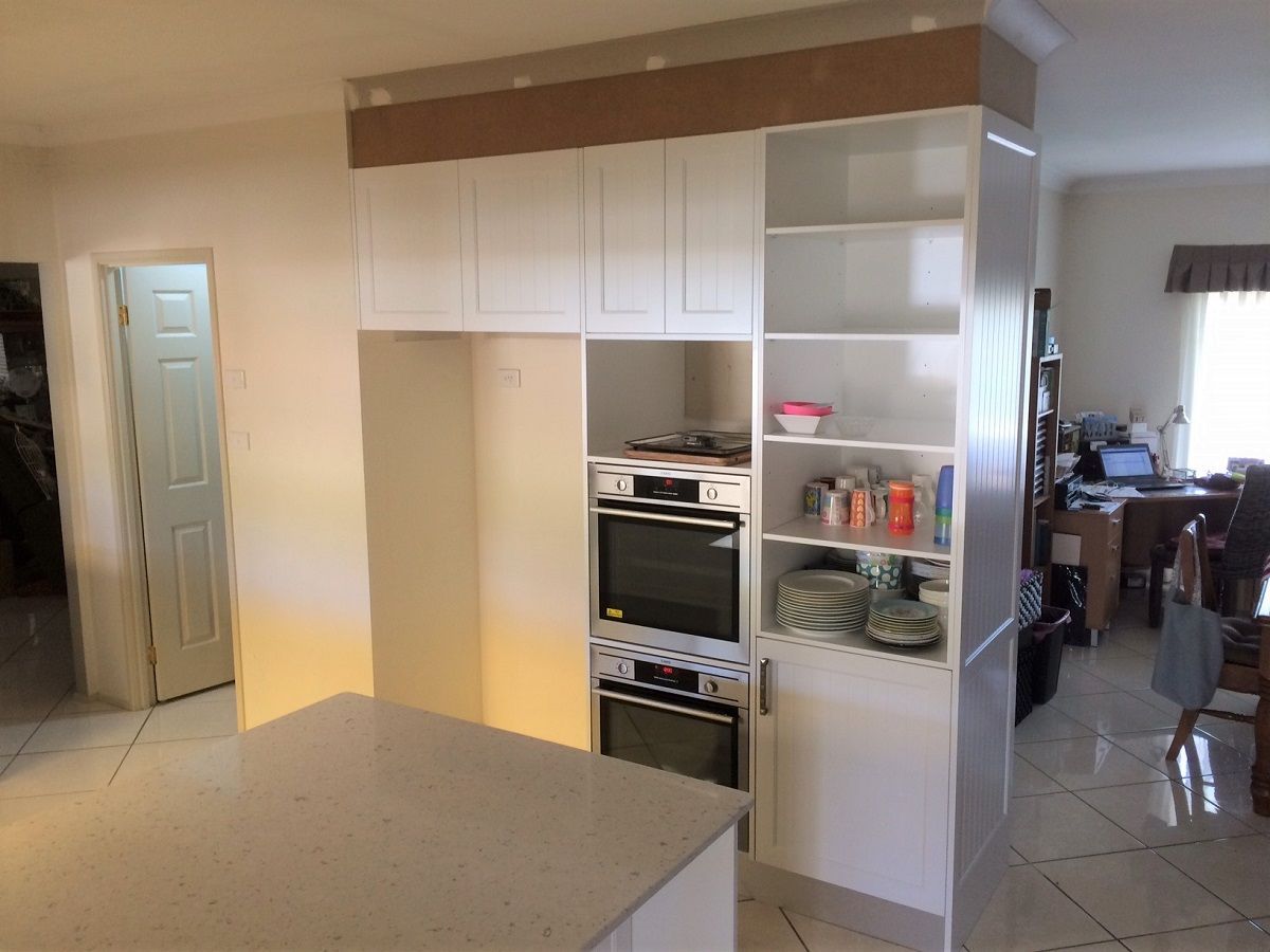 A Kitchen With a Table and Chairs in It — Hunter Kitchen King In Newcastle, NSW