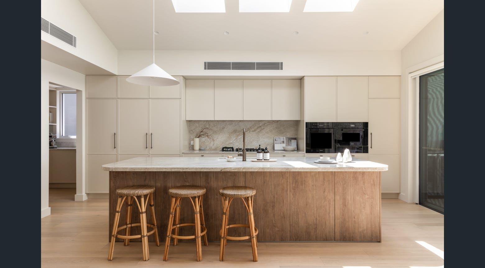 A front on view of a modern kitchen island with three stools — Hunter Kitchen King In Rutherford, NSW