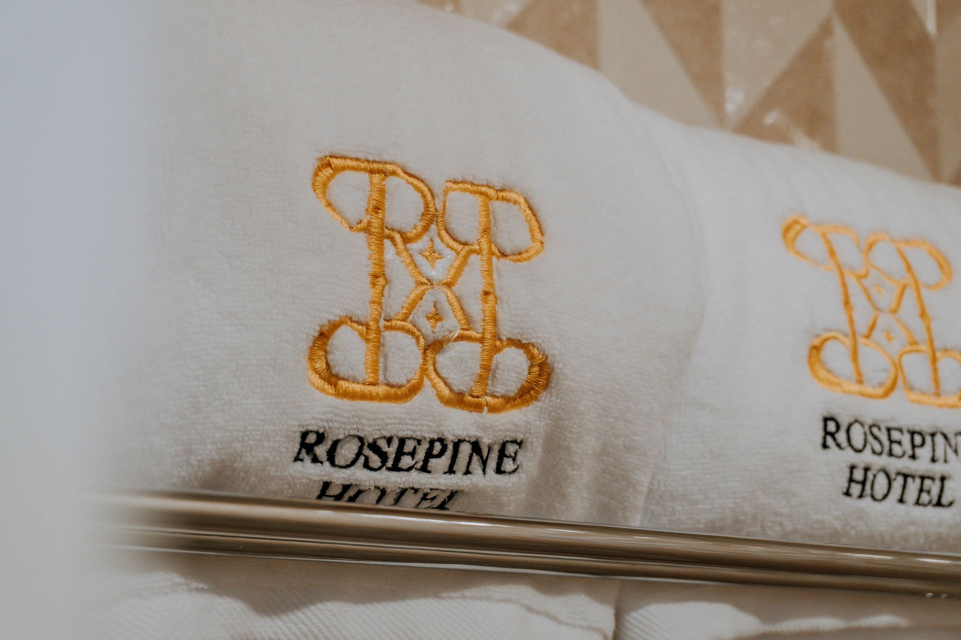 White bathrobes with gold embroidery of 