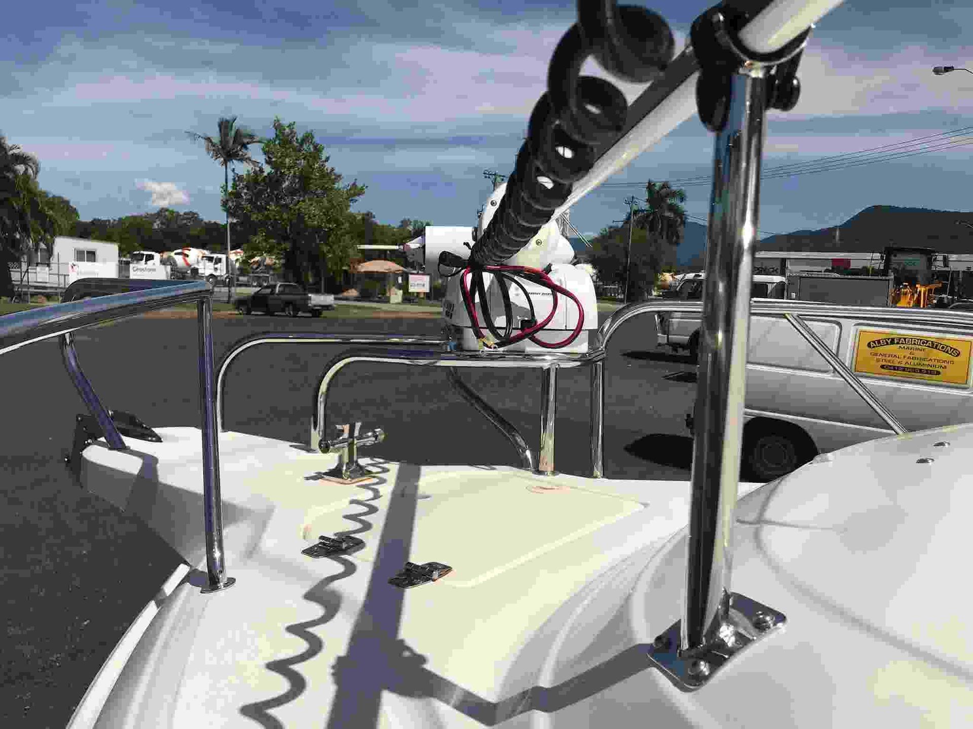 A Boat is Parked in a Parking Lot With a Sign That Says Fishing on It — Boyd's Fabrications In Portsmith, QLD 