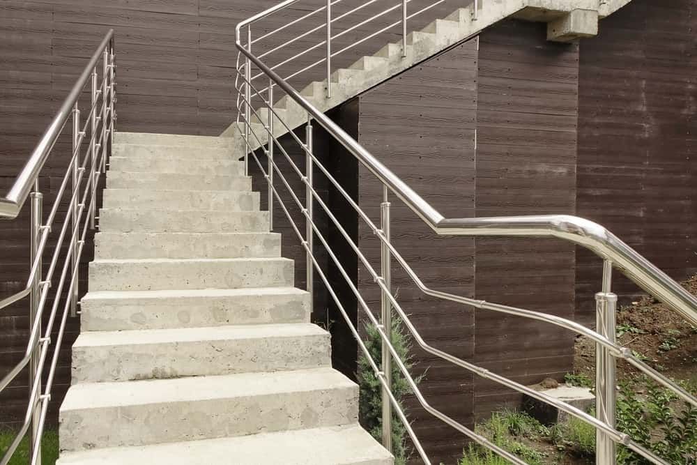 A Set of Stairs With a Stainless Steel Railing Leading Up to a Building — Boyd's Fabrications In Gordonvale, QLD