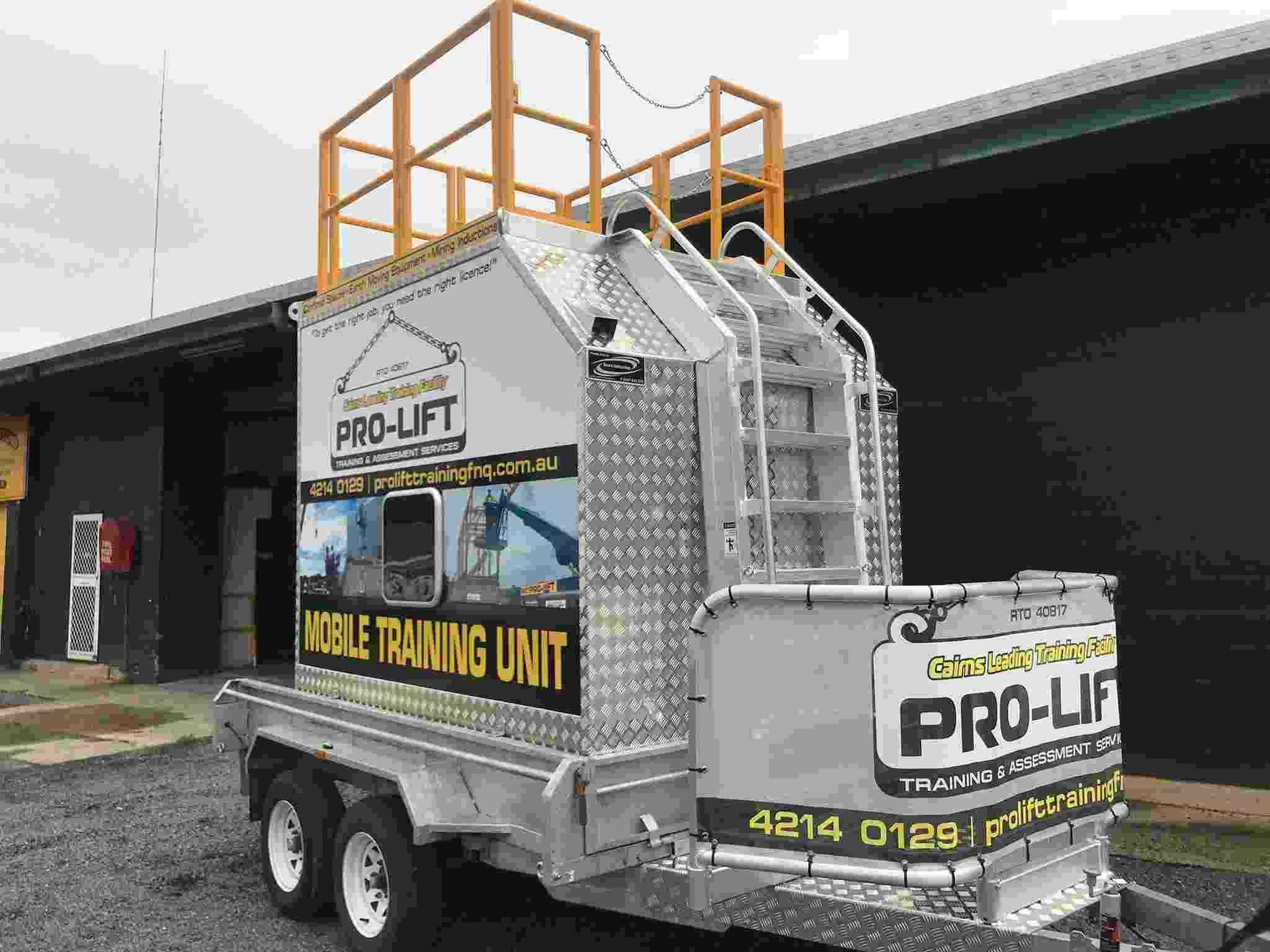 A Trailer That Says Pro-lift on It is Parked in Front of a Building — Boyd's Fabrications In Portsmith, QLD 