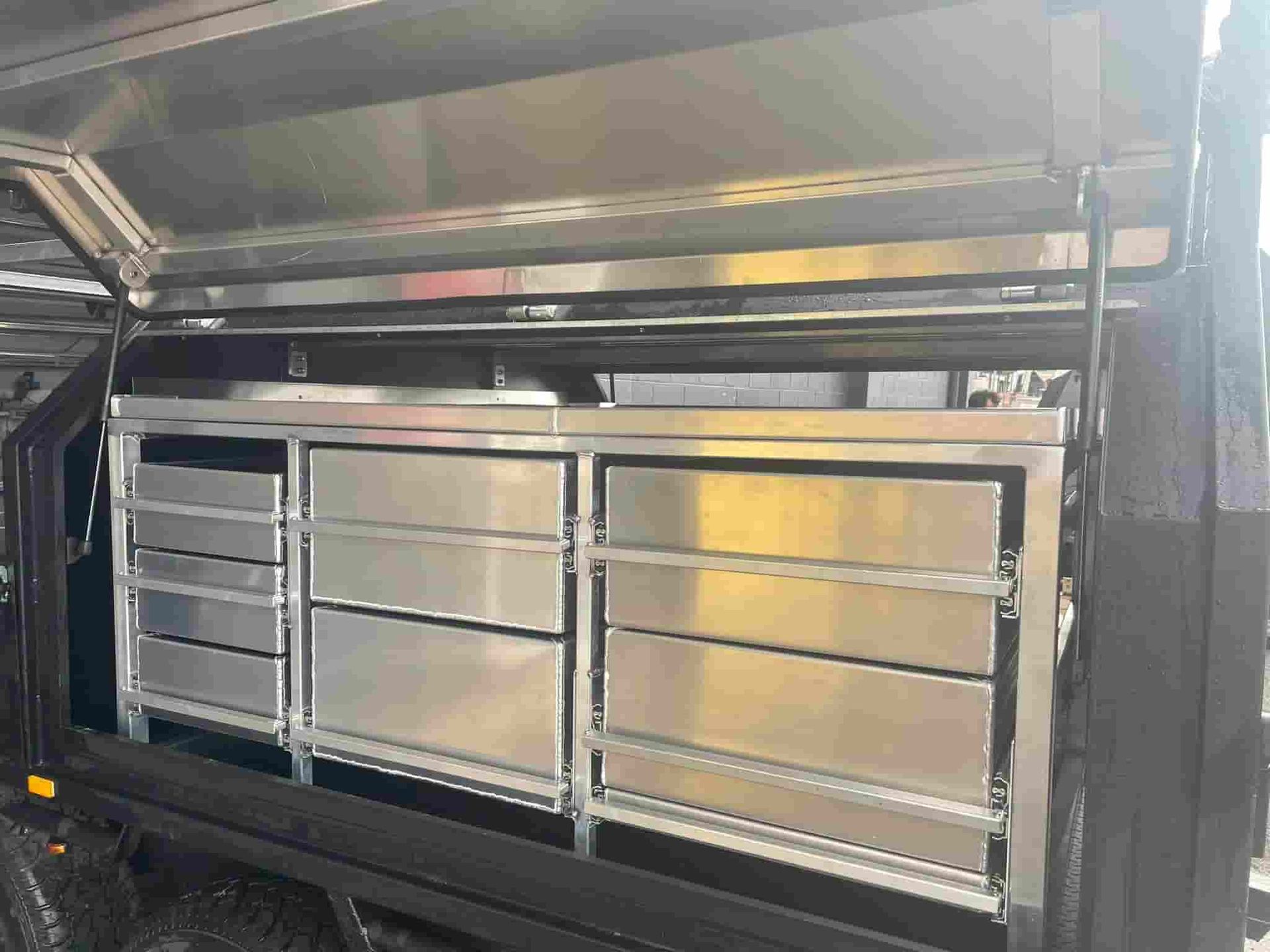 A Stainless Steel Cabinet With Drawers on the Side of a Truck — Boyd's Fabrications In Mt. Isa, QLD