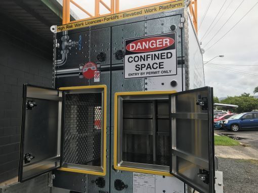 A Danger Confined Space Sign is on the Side of a Building — Boyd's Fabrications In Mt. Isa, QLD
