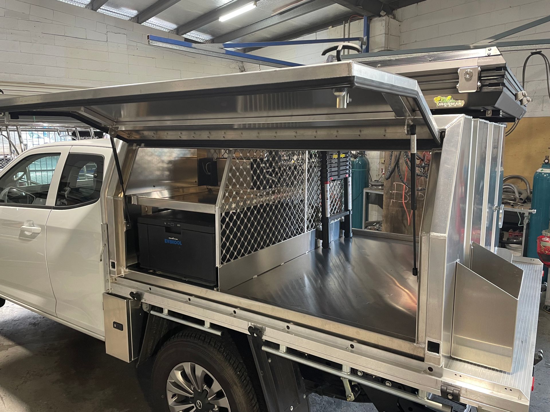 White pickup truck with open aluminum canopy; interior storage visible.— Boyd's Fabrications In Portsmith, QLD 