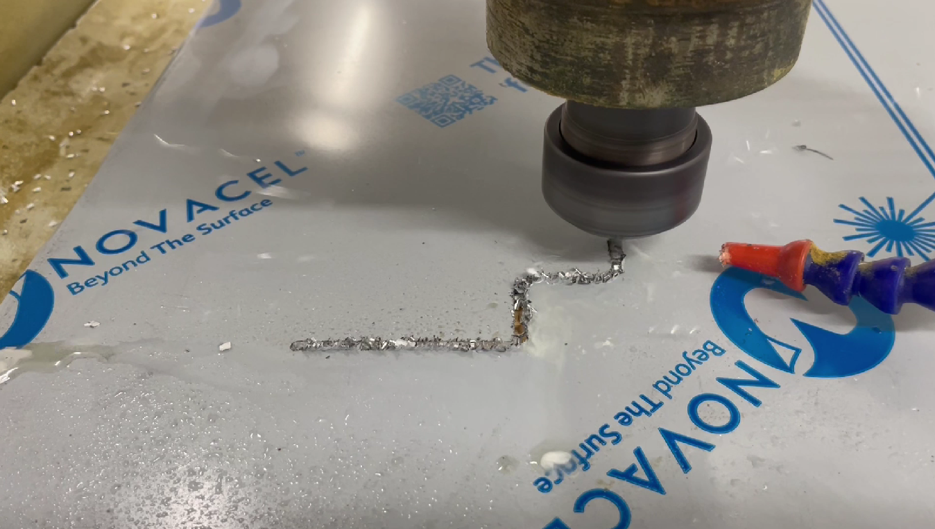 Automated Cutting Machine Cutting a Puzzle Shape From a White Board — Boyd's Fabrications In Mt. Isa, QLD