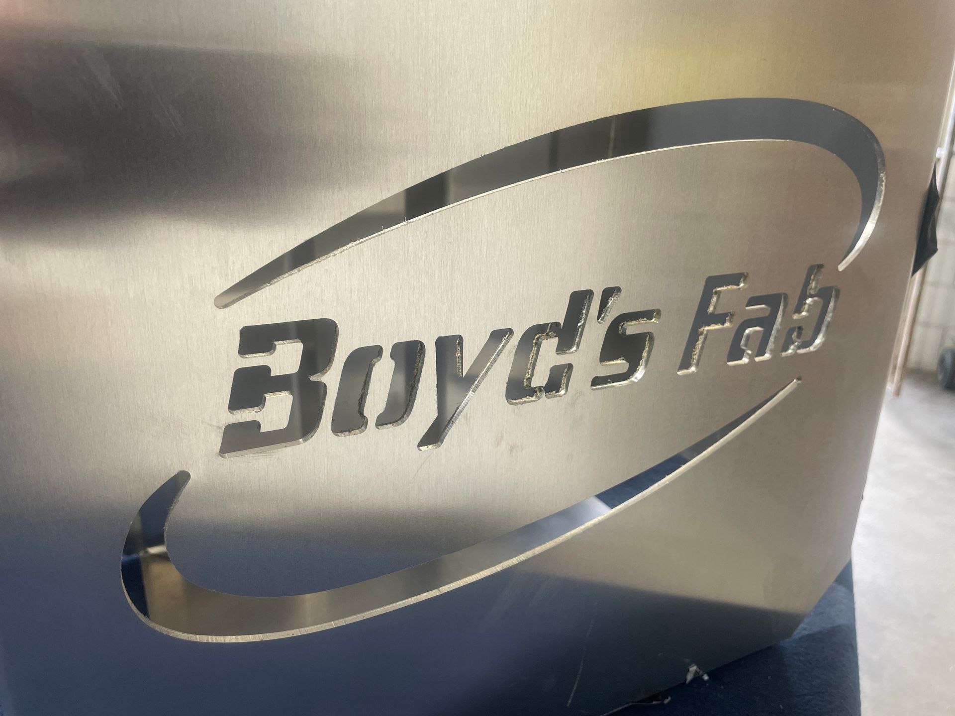 Cnc Machine Cutting White Plastic, Creating White Shavings — Boyd's Fabrications In Portsmith, QLD